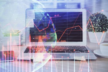 Finansal tablo çizimi ve arka planda bilgisayar olan bir tablo. Çoklu maruz kalma. Uluslararası pazarlar kavramı.