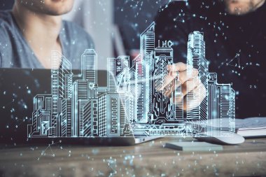 Arka planda bilgisayar üzerinde çalışan bir iş adamı ile yüksek teknoloji şehir çizimi. Akıllılık konsepti. Çift pozlama.