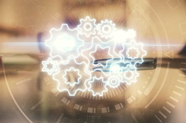 Ofisteki kahve fincanının arka planında iki kez finansal temaya maruz kalma hologramı çiziyor. Uluslararası iş kavramı.