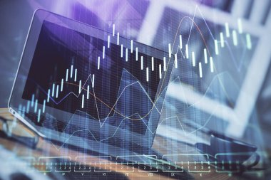 Finansal grafik renkli çizimler ve arka planda bilgisayar olan tablolar. Çifte maruziyet. Uluslararası pazarlar kavramı.
