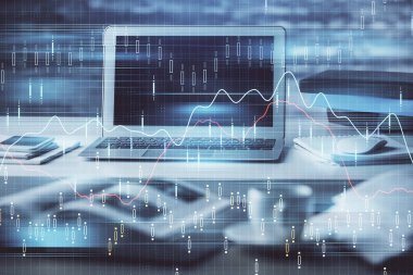 Finansal grafik renkli çizimler ve arka planda bilgisayar olan tablolar. Çoklu maruz kalma. Uluslararası pazarlar kavramı.