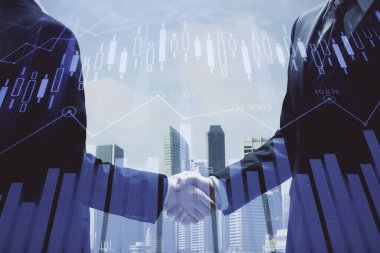 Forx grafik hologramı ve iki adamın el sıkışması. Borsa konsepti.