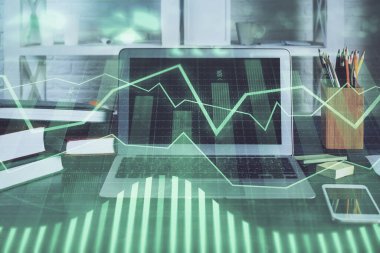 Arka planda eski pazar grafik hologramı ve kişisel bilgisayar var. Çifte maruziyet. Yatırım kavramı.