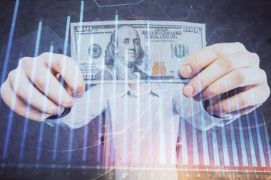 Finansal grafiğe çoklu pozlama hologram, Amerikan dolarları ve insan eli. Analiz kavramı.