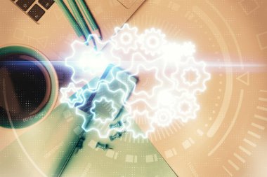 Masaüstü arkaplanındaki bilgisayarın üzerinde iş temalı hologram çizimleri. Üst Manzara. Çoklu maruz kalma. Uluslararası bağlantılar kavramı.