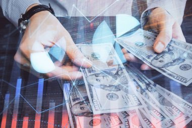 Finansal grafiğe çoklu pozlama hologram, Amerikan dolarları ve insan eli. Analiz kavramı.