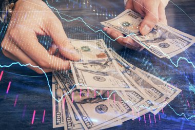 Finansal grafiğe çoklu pozlama hologram, Amerikan dolarları ve insan eli. Analiz kavramı.