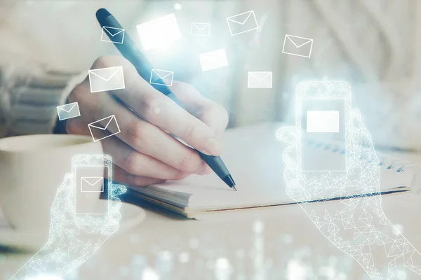 E-mail abstract envelop drawing over hands taking notes background. Concept of electronic mail. Double exposure — Stock Photo, Image