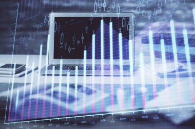 Finansal pazar grafiği hologramı ve kişisel bilgisayar arka planda. Çifte maruziyet. Önx kavramı.