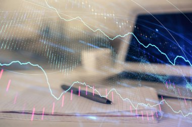 Finansal grafik çizimleri ve açık defter arkaplanı olan bir masa. Önx pazarı kavramı