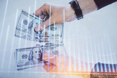 Finansal grafiğe çoklu pozlama hologram, Amerikan dolarları ve insan eli. Analiz kavramı.