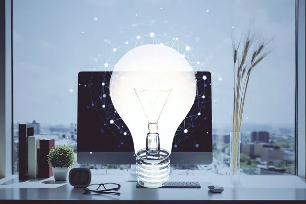 Dator på kontoret med lampikon hologram. Dubbel exponering. Begreppet idé. — Stockfoto