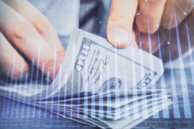 Forx grafiği, hologram, Amerikan dolarları ve insan eli çizimleri. Teknik Analiz kavramı.