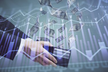 Finansal grafiğe çoklu pozlama hologram, Amerikan dolarları ve insan eli. Analiz kavramı.