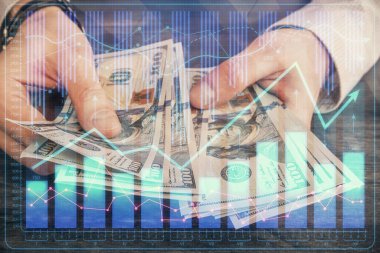 Finansal grafiğe çoklu pozlama hologram, Amerikan dolarları ve insan eli. Analiz kavramı.