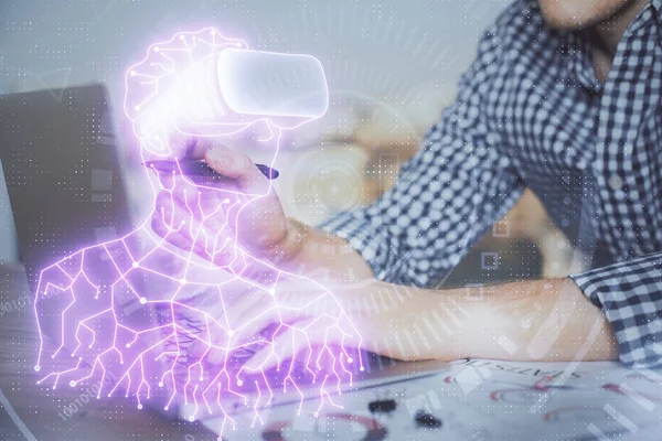 AR hologram with man working on computer on background. Augmented reality concept. Double exposure.