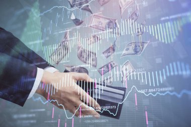 Finansal grafiğe çoklu pozlama hologram, Amerikan dolarları ve insan eli. Analiz kavramı.
