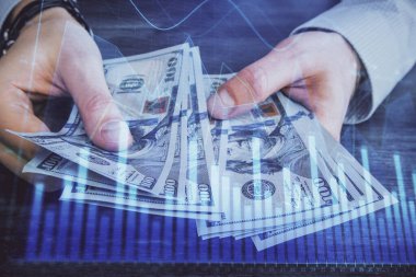 Finansal grafiğe çoklu pozlama hologram, Amerikan dolarları ve insan eli. Analiz kavramı.