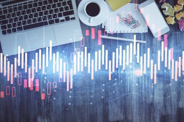 Finans piyasası grafiği ve masaüstü bilgisayarının üst görüntüsü. Çifte maruziyet. Yatırım kavramı.