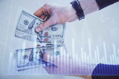 Finansal grafiğe çoklu pozlama hologram, Amerikan dolarları ve insan eli. Analiz kavramı.