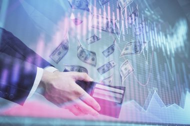 Finansal grafiğe çoklu pozlama hologram, Amerikan dolarları ve insan eli. Analiz kavramı.