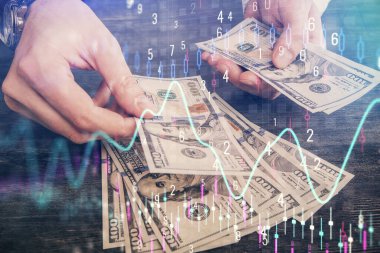 Finansal grafiğe çoklu pozlama hologram, Amerikan dolarları ve insan eli. Analiz kavramı.