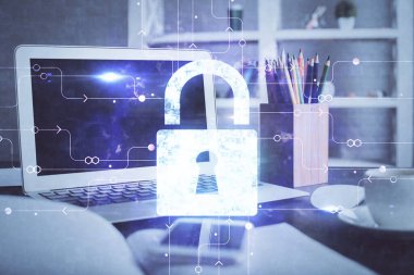 Bilgisayar ve ikon hologramı ile masaüstüne çift pozlama. Veri güvenliği kavramı.