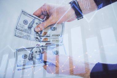 Finansal grafiğe çoklu pozlama hologram, Amerikan dolarları ve insan eli. Analiz kavramı.