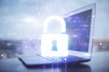 Bilgisayar ve ikon hologramı ile masaüstüne çift pozlama. Veri güvenliği kavramı.