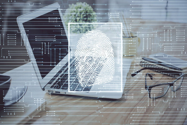 Computer on desktop in office with finger print drawing. Double exposure. Concept of business data security.
