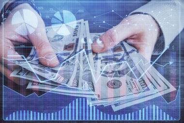 Finansal grafiğe çoklu pozlama hologram, Amerikan dolarları ve insan eli. Analiz kavramı.