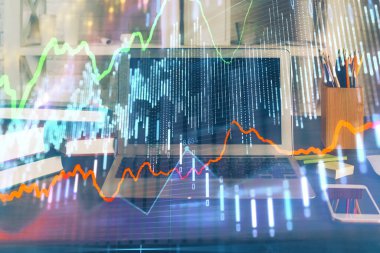 Finansal grafik renkli çizimler ve arka planda bilgisayar olan tablolar. Çifte maruziyet. Uluslararası pazarlar kavramı.