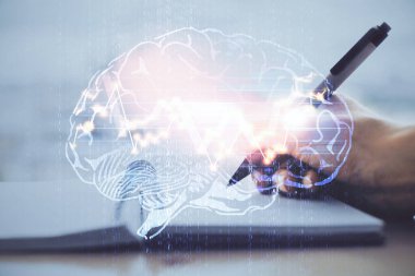 Arka planda beyin hologramıyla el yazısının iki katına çıkarılması. Öğrenme kavramı.