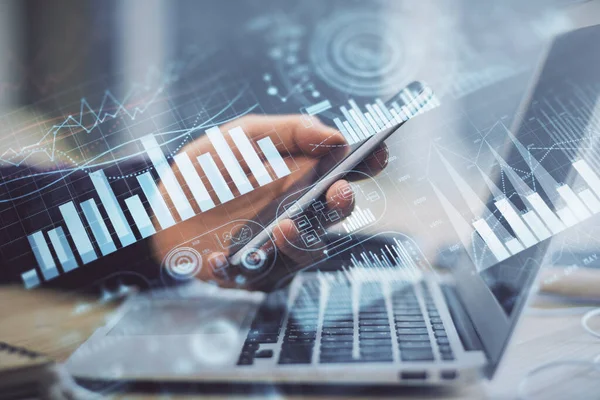 Double exposure of mans hands holding and using a phone and financial graph drawing. Analysis concept. — Stock Photo, Image