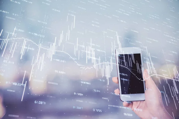 Double exposure of forex chart sketch hologram and woman holding and using a mobile device. Stock market concept.