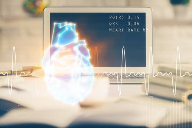 Masaüstü bilgisayar arka planı ve kalp çizimi. Çifte maruziyet. Tıp eğitimi ve sağlık konsepti.