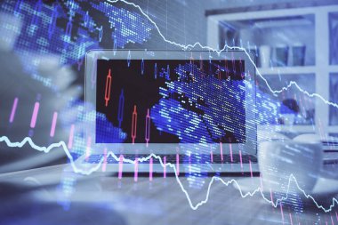 Finansal tablo çizimi ve arka planda bilgisayar olan bir tablo. Çoklu maruz kalma. Uluslararası pazarlar kavramı.