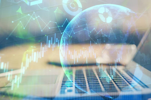 Double exposure of chart and financial info and work space with computer background. Concept of international online trading.