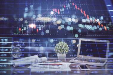 Arka planda eski pazar grafik hologramı ve kişisel bilgisayar var. Çoklu maruz kalma. Yatırım kavramı.