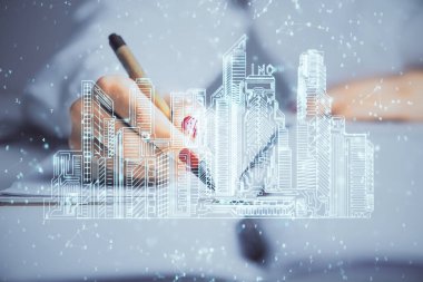 Not defterine el yazısının üzerini çiziyor. Ezik ev kavramı. Çoklu pozlama