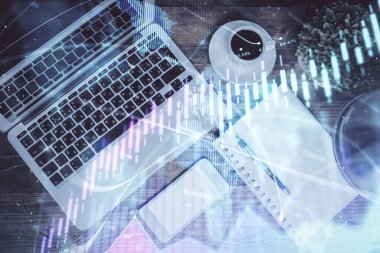 Finans piyasası grafiği ve masaüstü bilgisayarının üst görüntüsü. Çifte maruziyet. Yatırım kavramı.