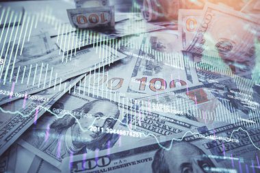 Forx grafiğinin çok sayıda görüntüsü bize dolar banknotları arka planında görünüyor. Finansal başarı piyasası kavramı.