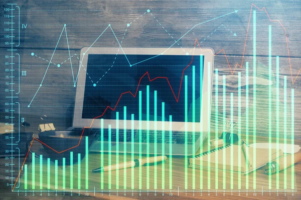 Multi exposure of chart and financial info and work space with computer background. Concept of international online trading.