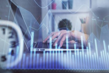 Bilgisayarda ve ön x grafik hologram çiziminde kadın eli yazarken çift pozlama. Borsa yatırım kavramı.