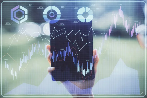 Double exposure of forex chart sketch hologram and woman holding and using a mobile device. Financial market concept.