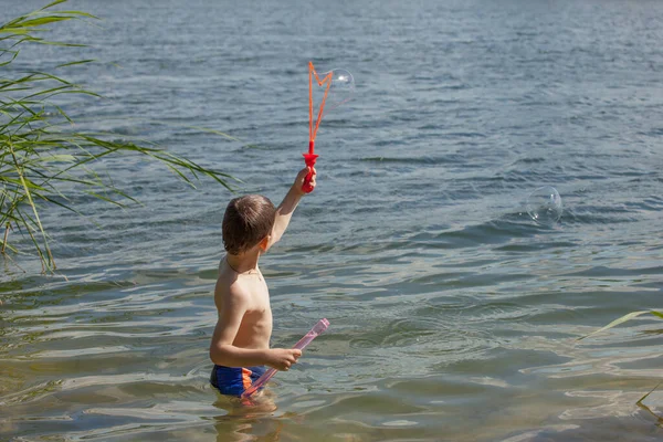 Little Boy Blowing Soap Bubbles Lake — Stock Photo, Image