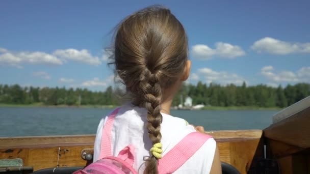 Little girl admiring the coastline of aboard a boat — Stock Video