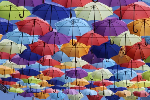 Beautiful alley of multi-colored umbrellas. Beautiful background