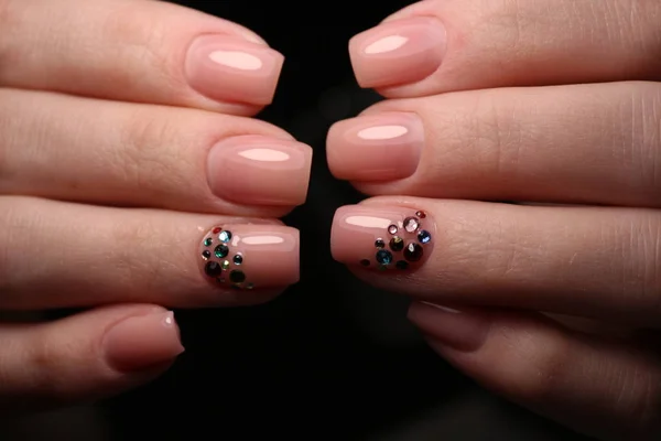 Closeup photo of a beautiful female hands with elegant manicure — Stock Photo, Image