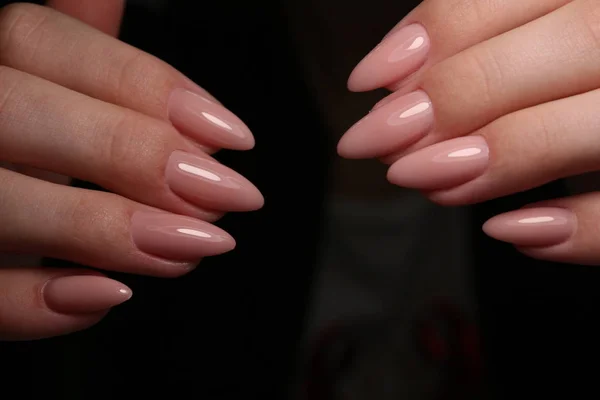 Amazing natural nails. Women's hands with clean manicure.